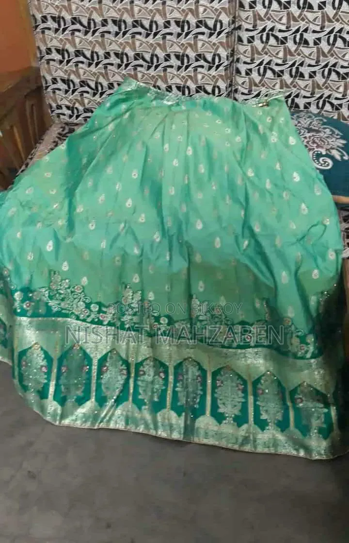 Nibir Bottle Green Color Lehenga
