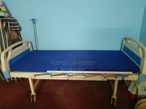 Medical bed with manual control for sale.