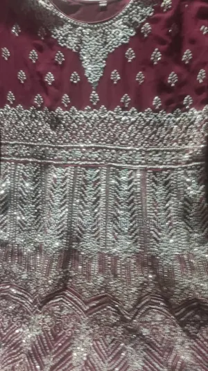I will sell a beautiful maroon colored gown dress to you