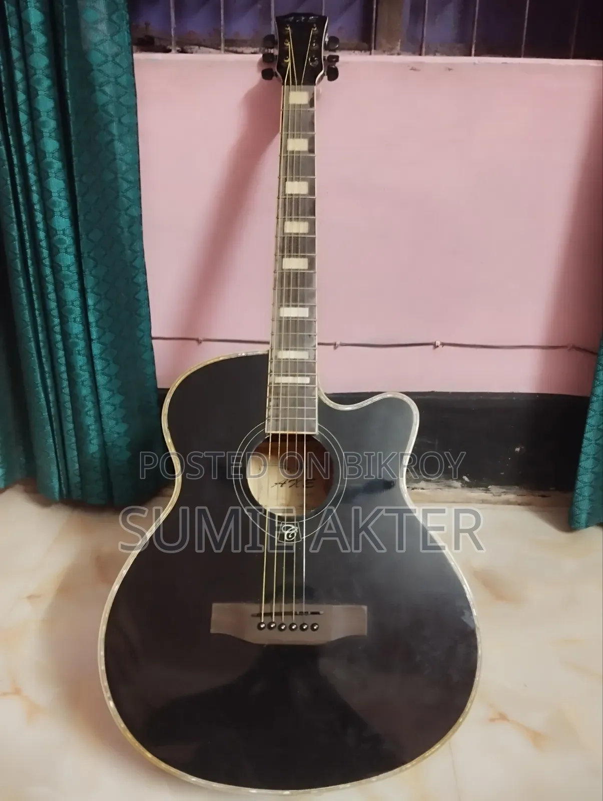 There is a good quality Axe Brand guitar available, anyone can take it if needed