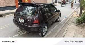 টয়োটা স্টারলেট ১৯৯৭ মেরুন