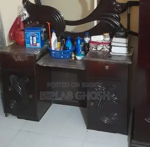 ড্রেসিং টেবিল উইথ টু ড্রয়ার্স এন্ড টু কেবিনেটস।