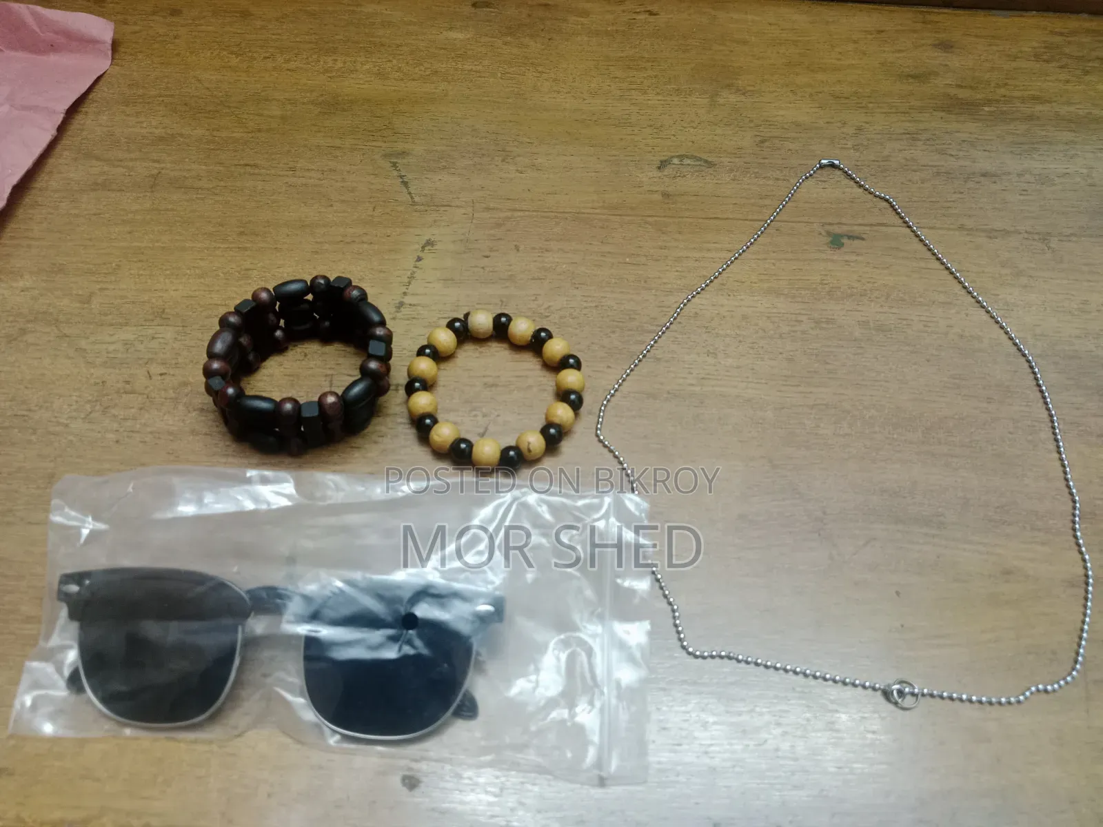 1 Cricket Bat, 2 Men's Bracelets, One Chain and One Sunglass