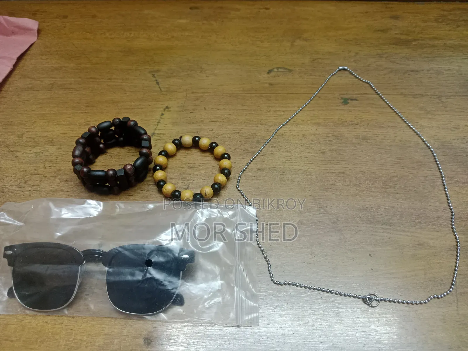 1 Cricket Bat, 2 Men's Bracelets, One Chain and One Sunglass