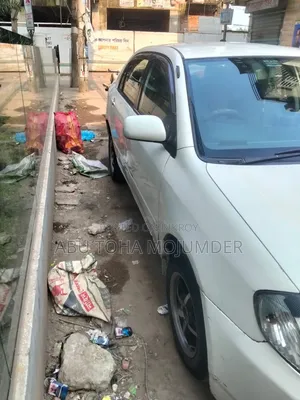 টয়োটা করোল্লা সেডান ২০০১ সাদা