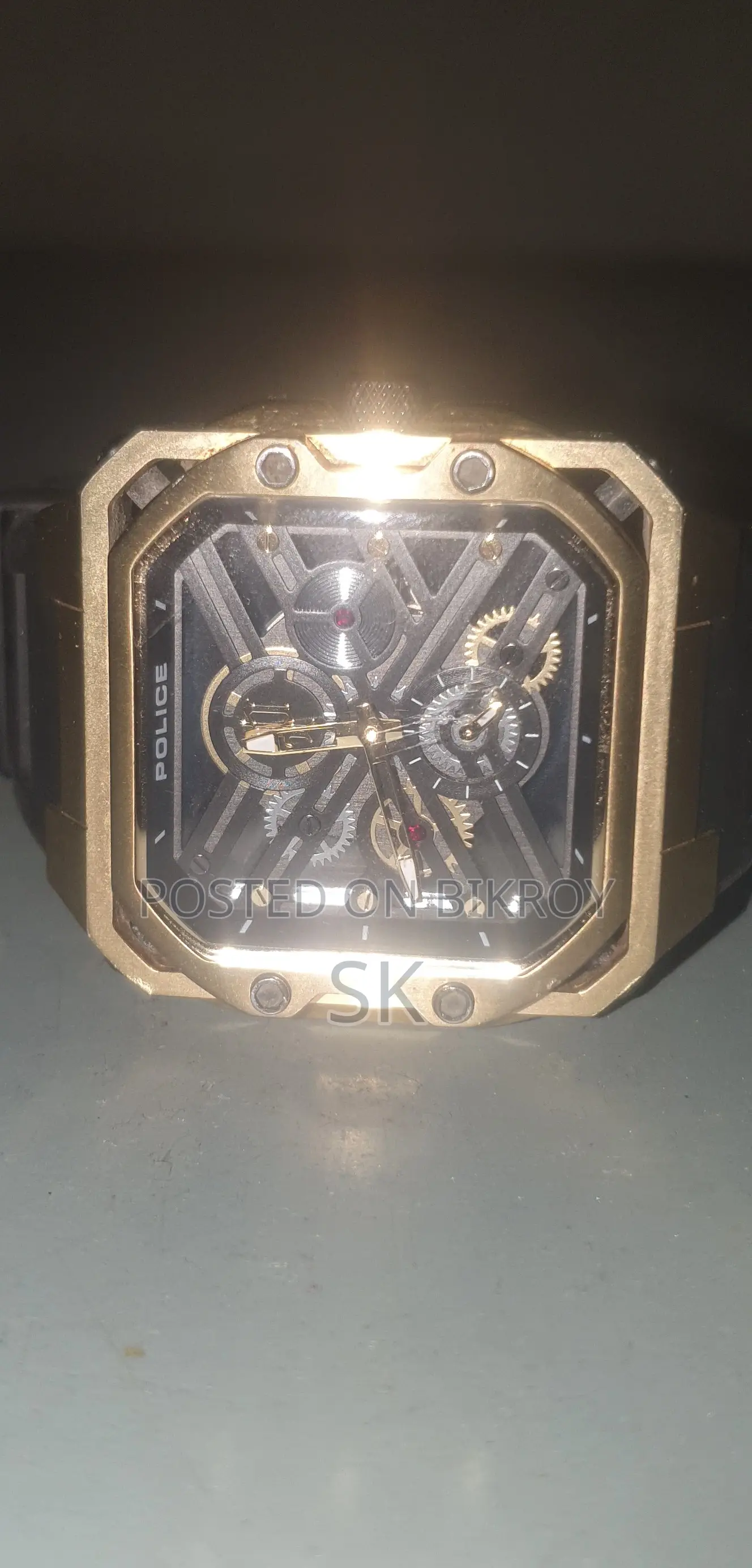 Stylish gold tone Police brand mechanical watch.