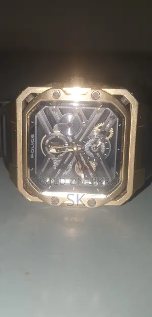 Stylish gold tone Police brand mechanical watch.