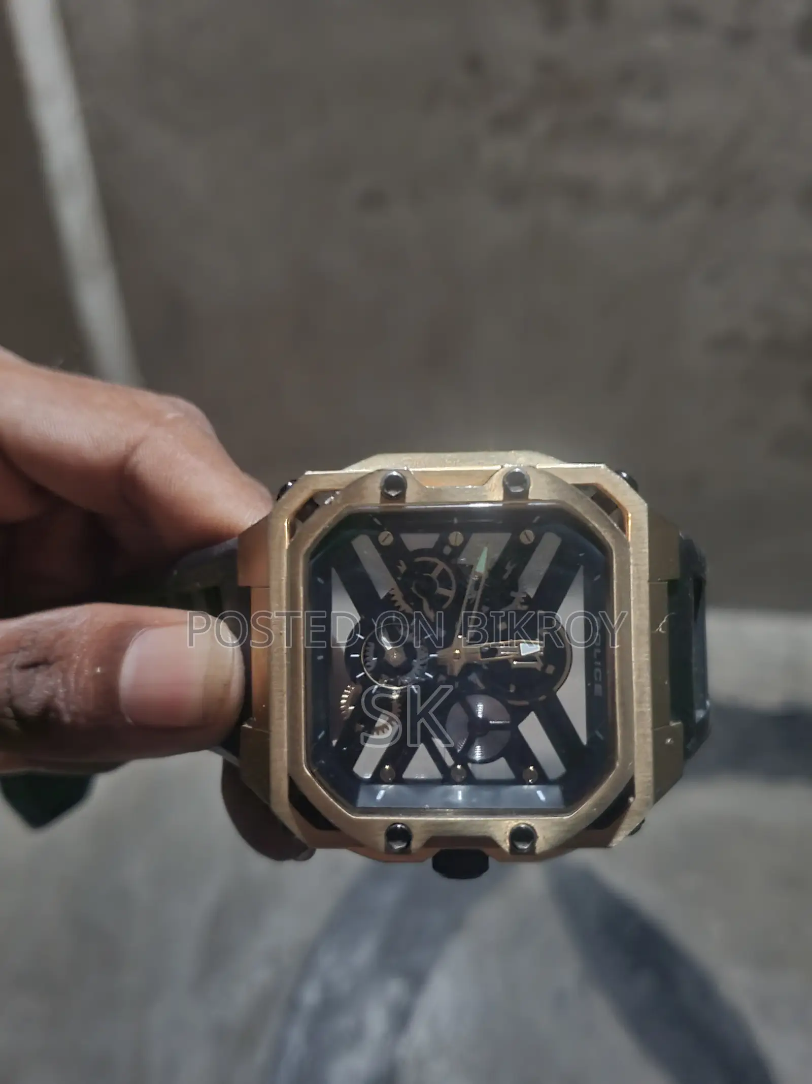 Stylish gold tone Police brand mechanical watch.