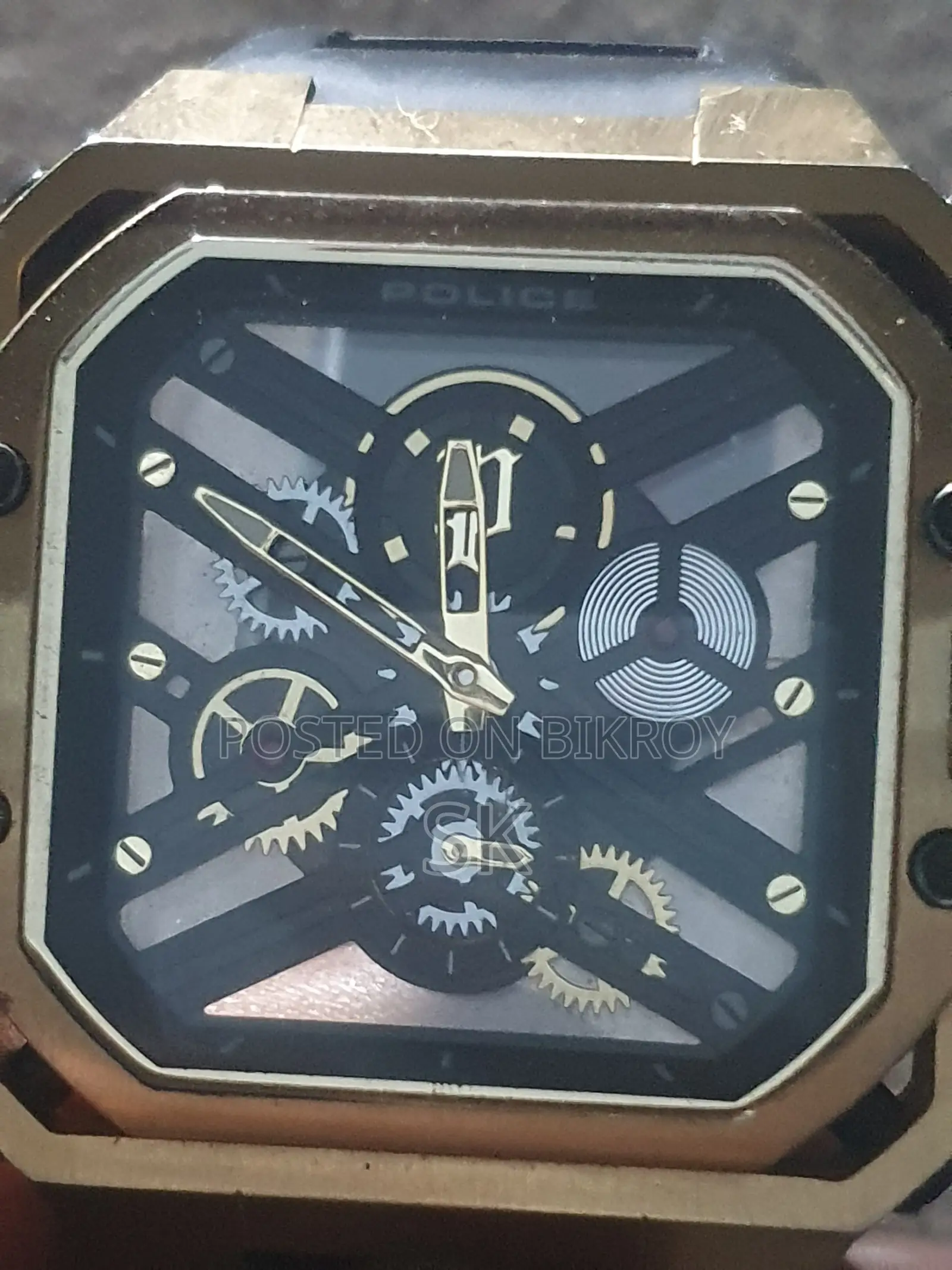 Stylish gold tone Police brand mechanical watch.