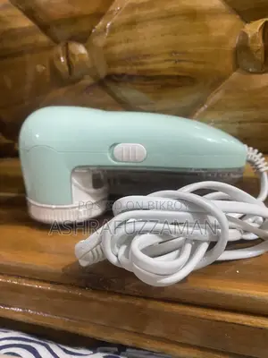 Fabric extra thread cutting machine