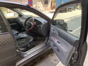 মিতসুবিশি ল্যান্সার ২০০৩ ব্রাউন