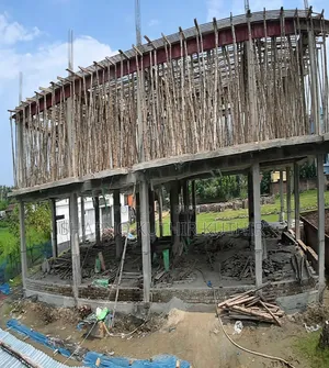 Share sale of a building under construction.