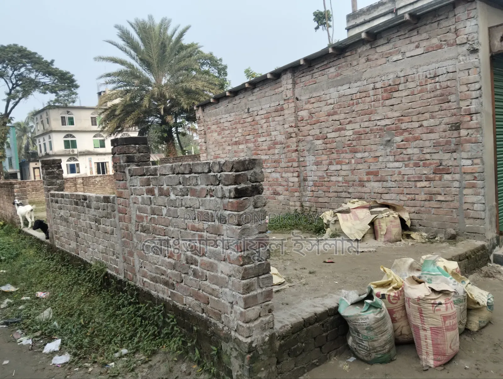 Land filled with soil suitable for building a house, sold with boundary and shop