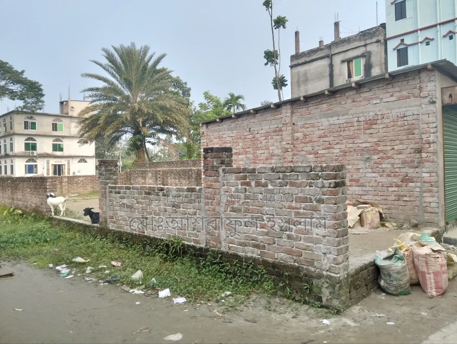 Land filled with soil suitable for building a house, sold with boundary and shop