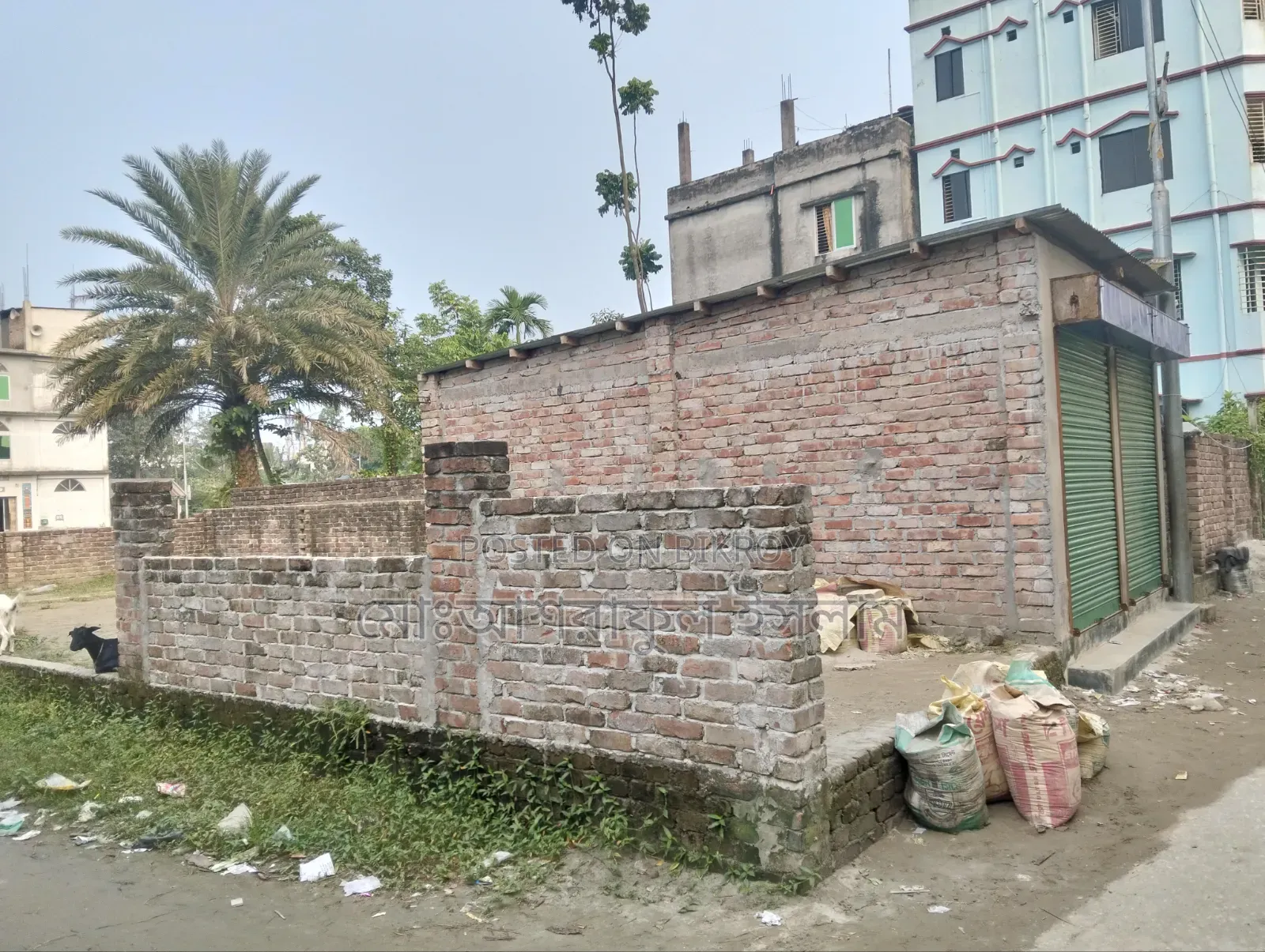 Land filled with soil suitable for building a house, sold with boundary and shop