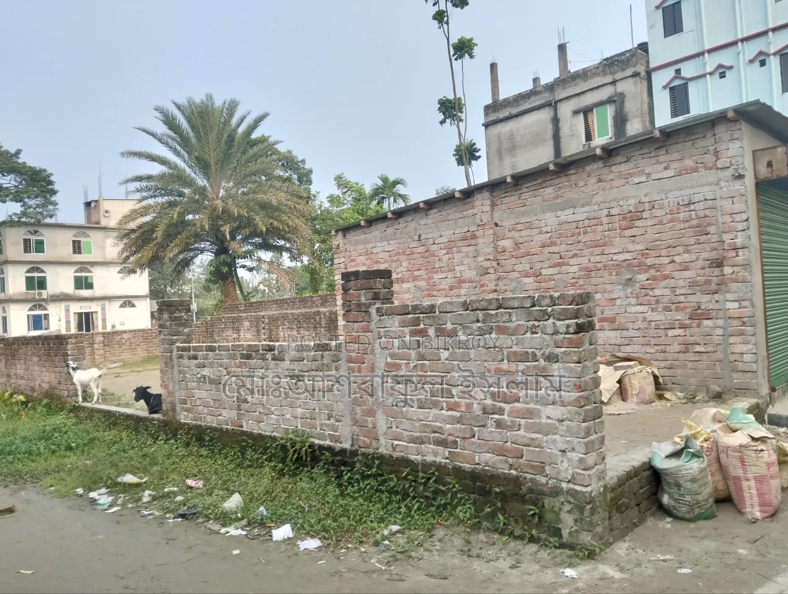 Land filled with soil suitable for building a house, sold with boundary and shop