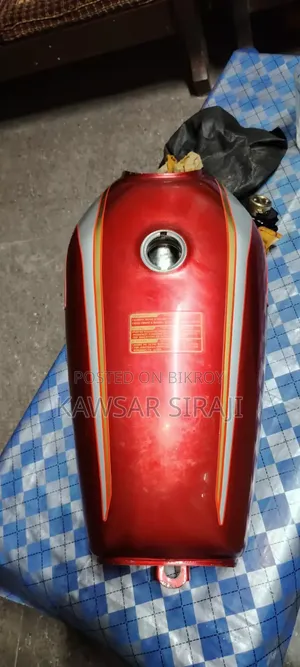 A red colored Freedom bike fuel tank for sale