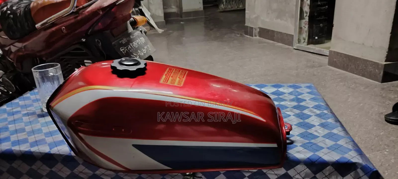 A red colored Freedom bike fuel tank for sale