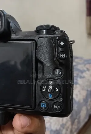Canon 50 Mark 2 + 15/45mm Kit Lens + 50mm Lens + 2 Batteries