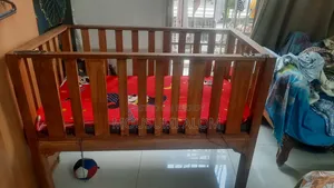 Wooden baby cot with mattress