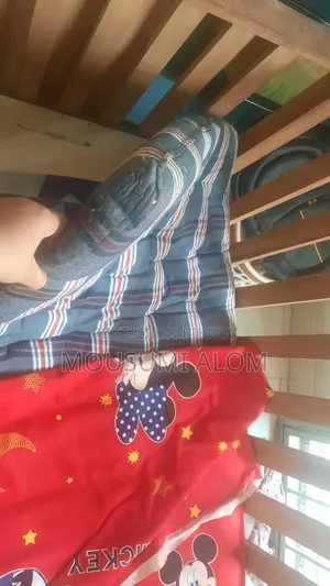 Wooden baby cot with mattress