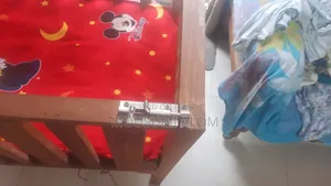 Wooden baby cot with mattress