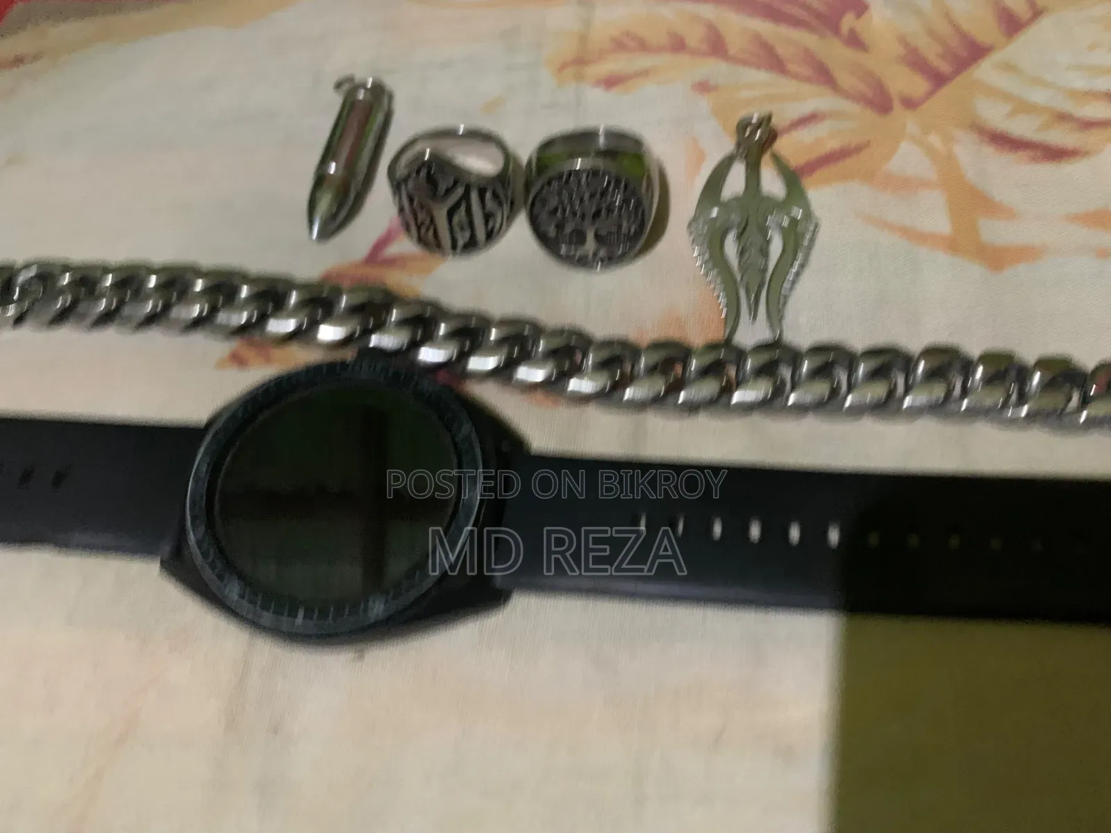 Some exclusive items for sale, watch, badge, ring, locket
