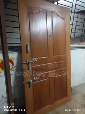 An iron wood (Ajubi) door frame and shutter will be sold with complete fittings.