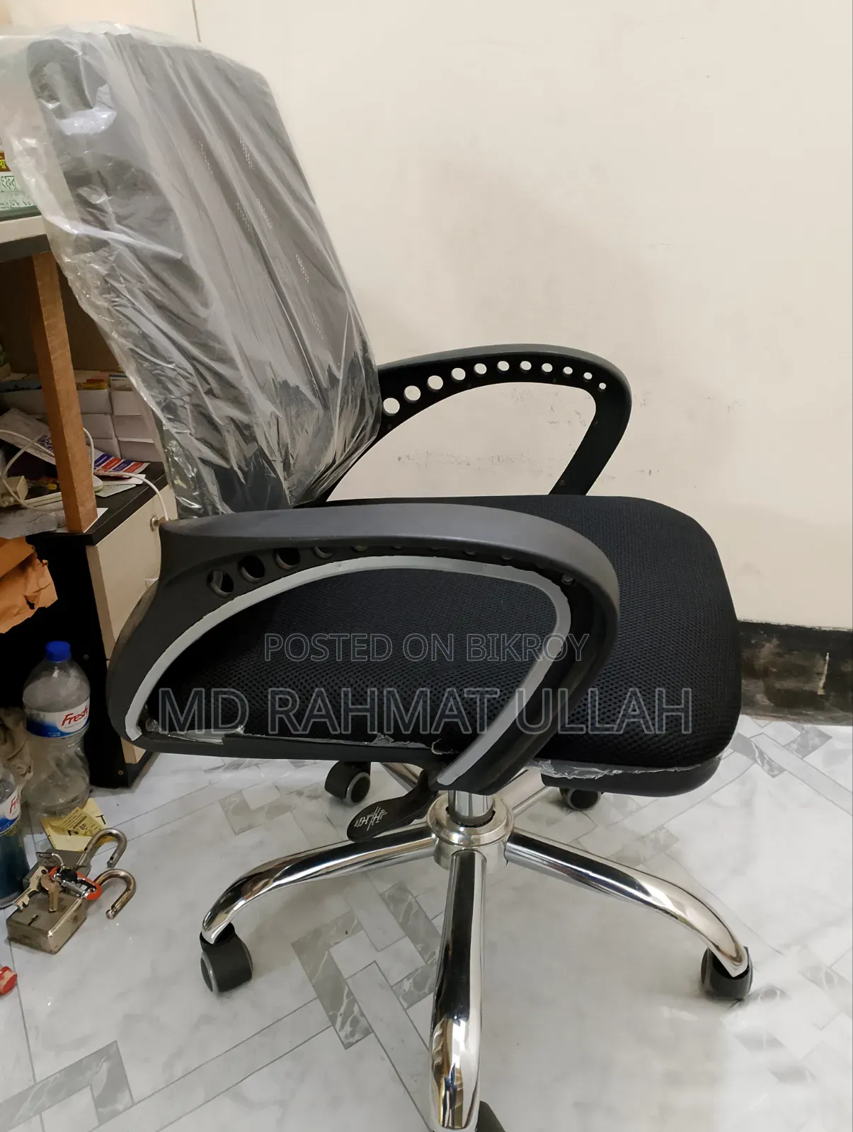 1 revolving chair and 1 20-inch by 30-inch plywood table.
