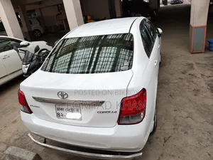টয়োটা অ্যাক্সিও ২০১৪ সাদা