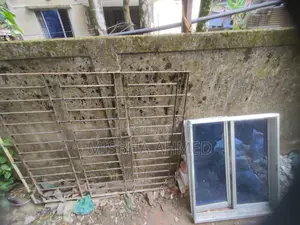 Used Iron Grill and Aluminum Thai Window