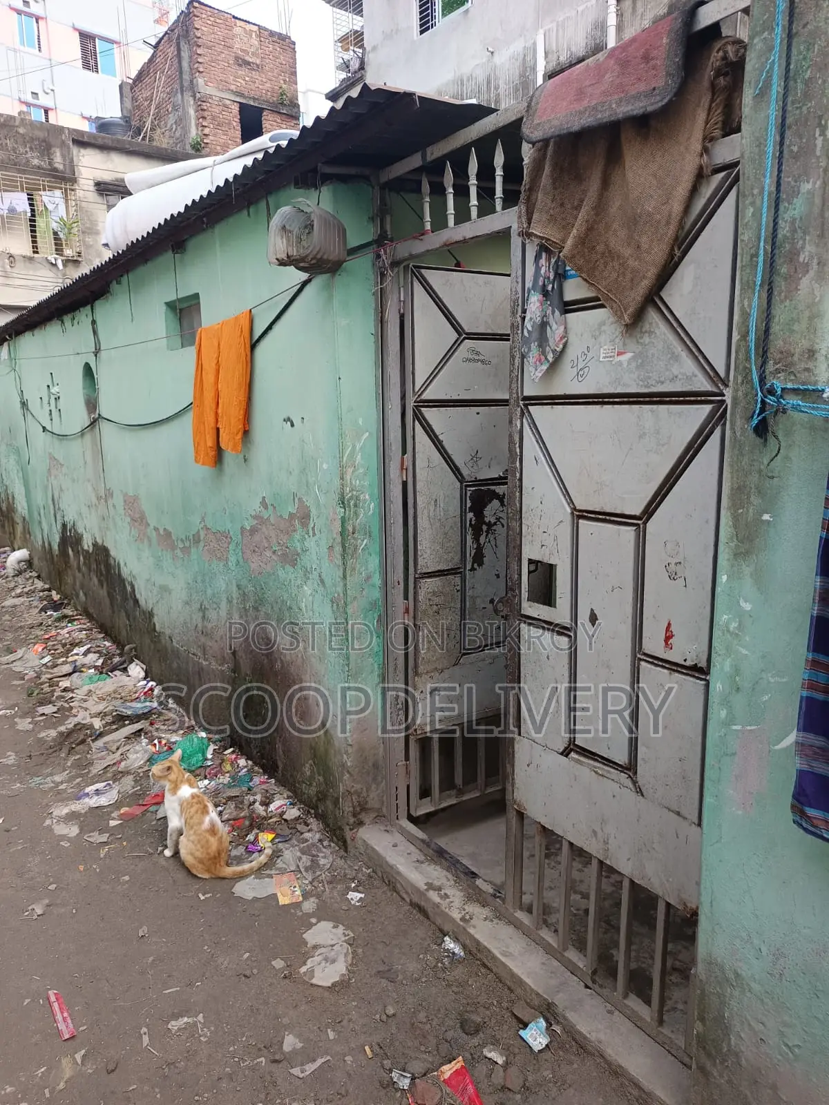 Tin-shed house for sale with 2 kathas of land and 2 double Titas gas connections