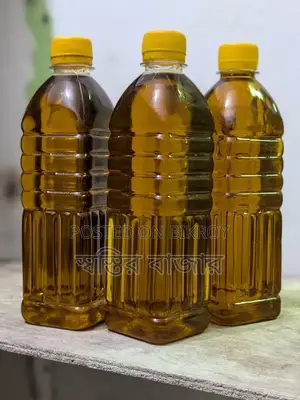 Pure mustard oil extracted through wooden churn (ghani).