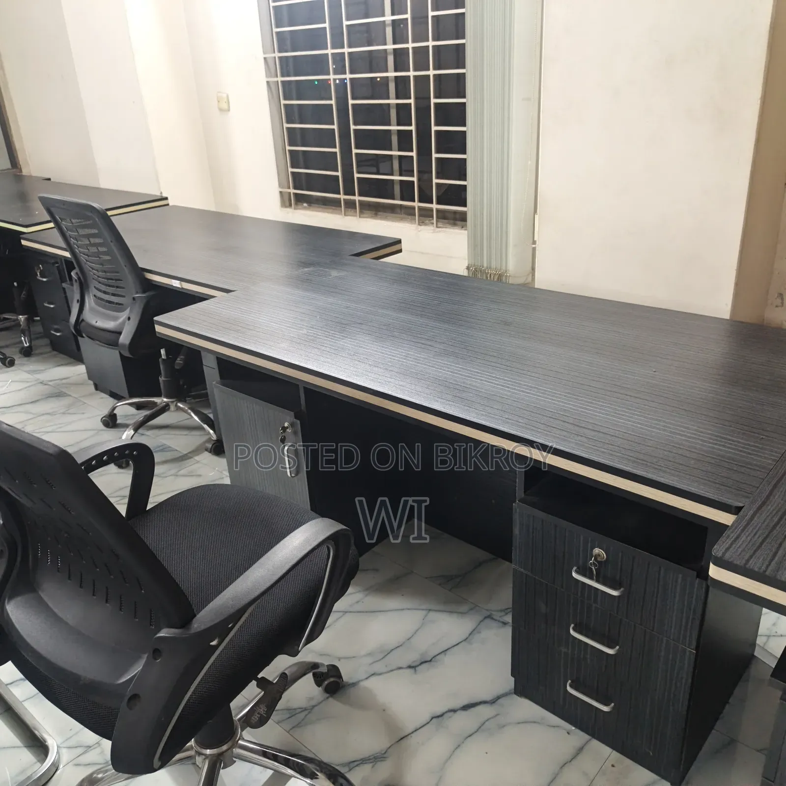 Five tables. One conference table. Twenty chairs of two types. One small super table