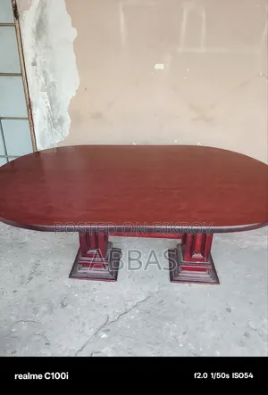 Teak wood dining table for sale. The top part is made of board.
